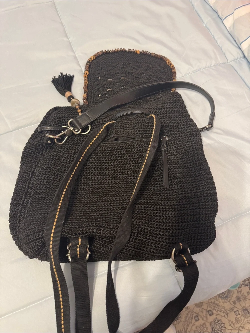 The Sak Black Woven Backpack with Tassel and Bead Accent